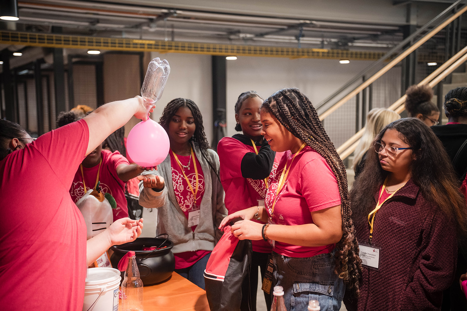 Instructor demonstrating chemistry to a group of students.